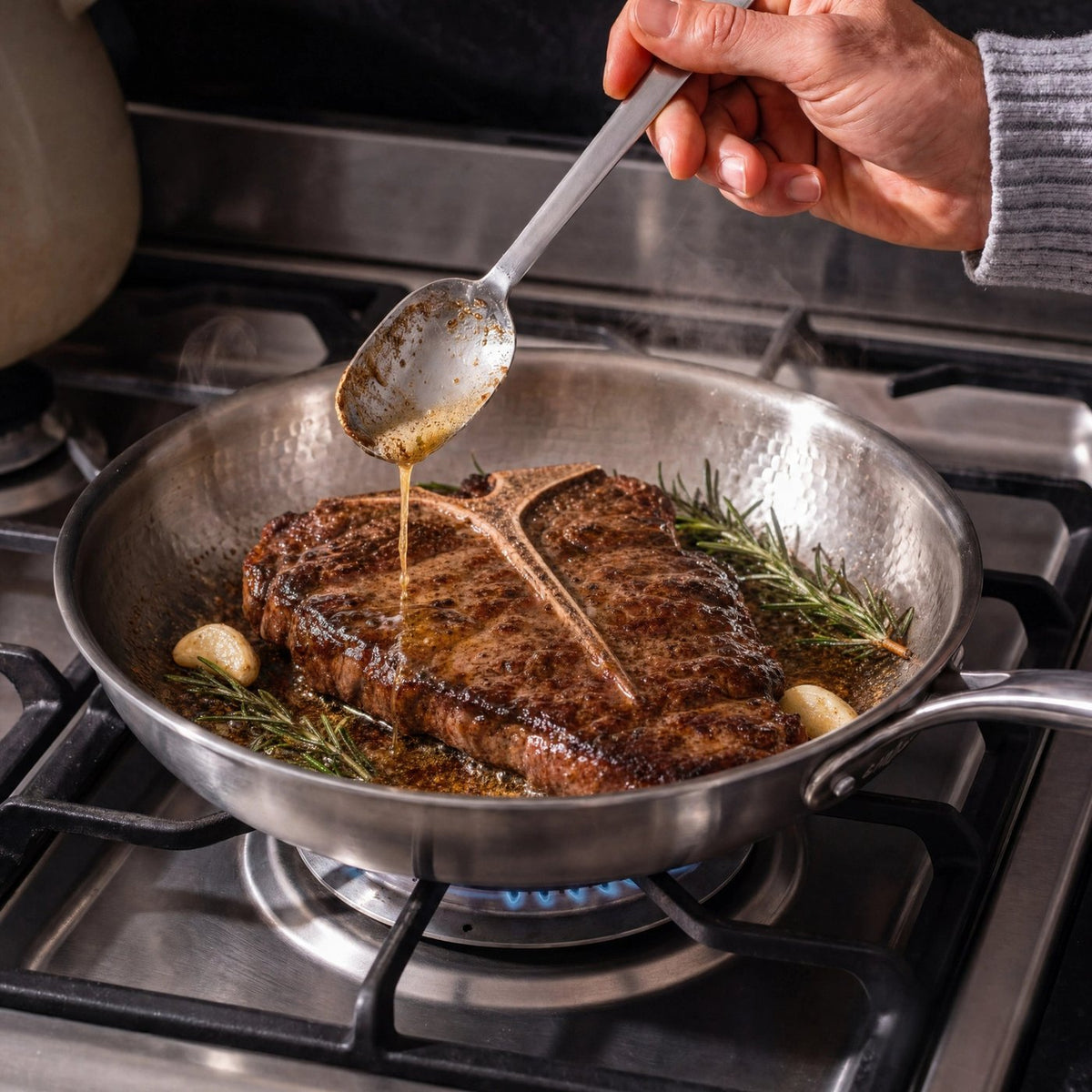 Steak being basted in the Monalura pan